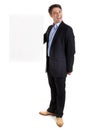 Dapper businessman with blank sign Royalty Free Stock Photo