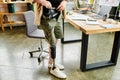 Dapper businessman with prosthetic leg capturing