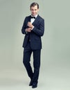 A dapper gentleman. A full length studio portrait of a stylish young gentleman giving a charming smile.