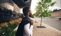 Dapper Indian businessman daydreaming looking into the distance with jacket over shoulder Royalty Free Stock Photo