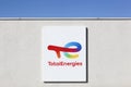 TotalEnergies logo on a wall