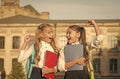 Dare to win. Happy winners celebrate outdoors. Happy girls make winner gesture. School contest winners. Celebrating Royalty Free Stock Photo