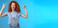 Daring cool sassy redhead ginger girl curly natural hairstyle winking joyfully yelling yeah enjoy awesome party dancing