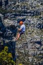 A daring European tourist rock climbing in Cape Town South Afric