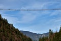 Daring tourists walk across Highline179 suspension bridge in Reutte, Tirol, Austria Royalty Free Stock Photo