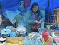 An unidentified Woman making and selling Momos and other food in a roadside stall near Darjeeling ropeway