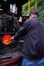 DARJEELING, INDIA - JUNE 22, 2022, Close up detail of steam engine toy train of Darjeeling Himalayan railway at station, Royalty Free Stock Photo