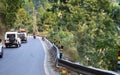 Cars on a mountain road with a very acute inner angle vehicles driving up to Darjeeling. traveling concept