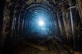 Dark abandoned coal mine with rusty lining in backlight Royalty Free Stock Photo