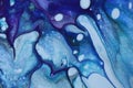 Dark abstract acrylic pour painting in cool colors for background..