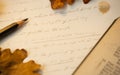 Dark academia aesthetic handwriting with Shakespeare sonnets surrounded by fallen autumn leaves