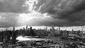 Dark aerial shot of the Manhattan skyline from Queens Court Square with backlighting