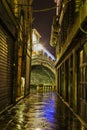Dark alley in Venice with Rialto Bridge Royalty Free Stock Photo