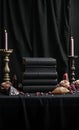 Dark Altar with Velvet and Books Royalty Free Stock Photo
