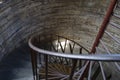 Dark ancient stone spiral staircase leading down Royalty Free Stock Photo