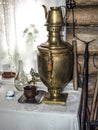 dark antique copper samovar on the table