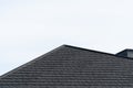 Dark asphalt tiles on the roof