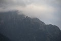 Dark atmospheric surreal landscape with a dark rocky mountain peak Royalty Free Stock Photo