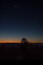 Dark autumn sky at sunrise when the moon shines in the sky