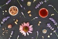 Backgrond with essential oil bottles with frankincense, myrrh, echinacea and lavender flowers, top view