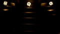 Dark background. Design. Three stairs without light with three glowing green and yellow balls that roll down and fall . Royalty Free Stock Photo