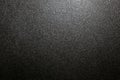 Dark background of hammered powder paint coating on flat sheet steel surface