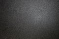 dark background of hammered powder paint coating on flat sheet steel surface