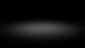 Dark background with a soft, diffused circular light gradient abstract Royalty Free Stock Photo