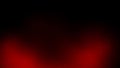 Dark background with soft red glowing light emanating from the bottom Royalty Free Stock Photo
