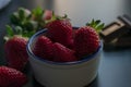 Strawberry white bowl photo with dark background Royalty Free Stock Photo