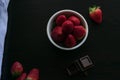 Strawberry white bowl photo with dark background