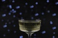 on a dark background there are two transparent figured glasses with champagne, decorated with a Christmas tree branch. holiday Royalty Free Stock Photo