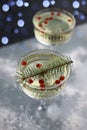 on a dark background there are two transparent figured glasses with champagne, decorated with a Christmas tree branch. holiday Royalty Free Stock Photo