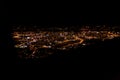 Dark background view of city with lights from aeroplane. Night lights in the city. Aeroplane view of dark nigh above the Royalty Free Stock Photo