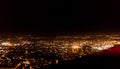 Dark background view of city with lights from aeroplane. Night lights in the city. Aeroplane view of dark nigh above the