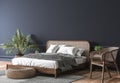 Dark bedroom interior mockup, wooden rattan bed on empty dark wall background, Scandinavian style Royalty Free Stock Photo