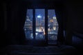 Dark bedroom with light on the skyscrapers