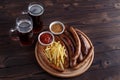 Dark beer and appetizing beer snacks set. Top view on table with Royalty Free Stock Photo