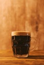 Dark beer in british dimpled glass pint mug