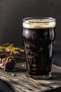 Dark beer in a steamed glass and grilled pork ribs