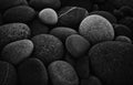 Dark black abstract smooth round pebbles sea texture background Royalty Free Stock Photo