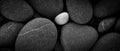 Dark black abstract smooth round pebbles sea texture background Royalty Free Stock Photo