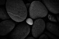 Dark black abstract smooth round pebbles texture background Royalty Free Stock Photo