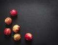 On a dark black background red yellow apples frame view from above flat lay horizontal Royalty Free Stock Photo