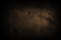 Dark black concrete wall with imperfections and natural cement texture as scary background texture with dark vignetting