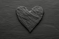 Black heart on rough slate like background