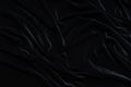 Dark black velvet fabric, wave, draperies. Beautiful textile backdrop. Close-up. Top view Royalty Free Stock Photo