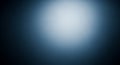 Dark blue abstract background with a bright white light source creating a soft gradient and a sense of depth and mystery Royalty Free Stock Photo