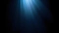 A dark blue abstract background with light rays shining down from the top of the frame area view Royalty Free Stock Photo