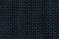 Dark blue background with checkered pattern, closeup. Structure of the fabric macro. Royalty Free Stock Photo